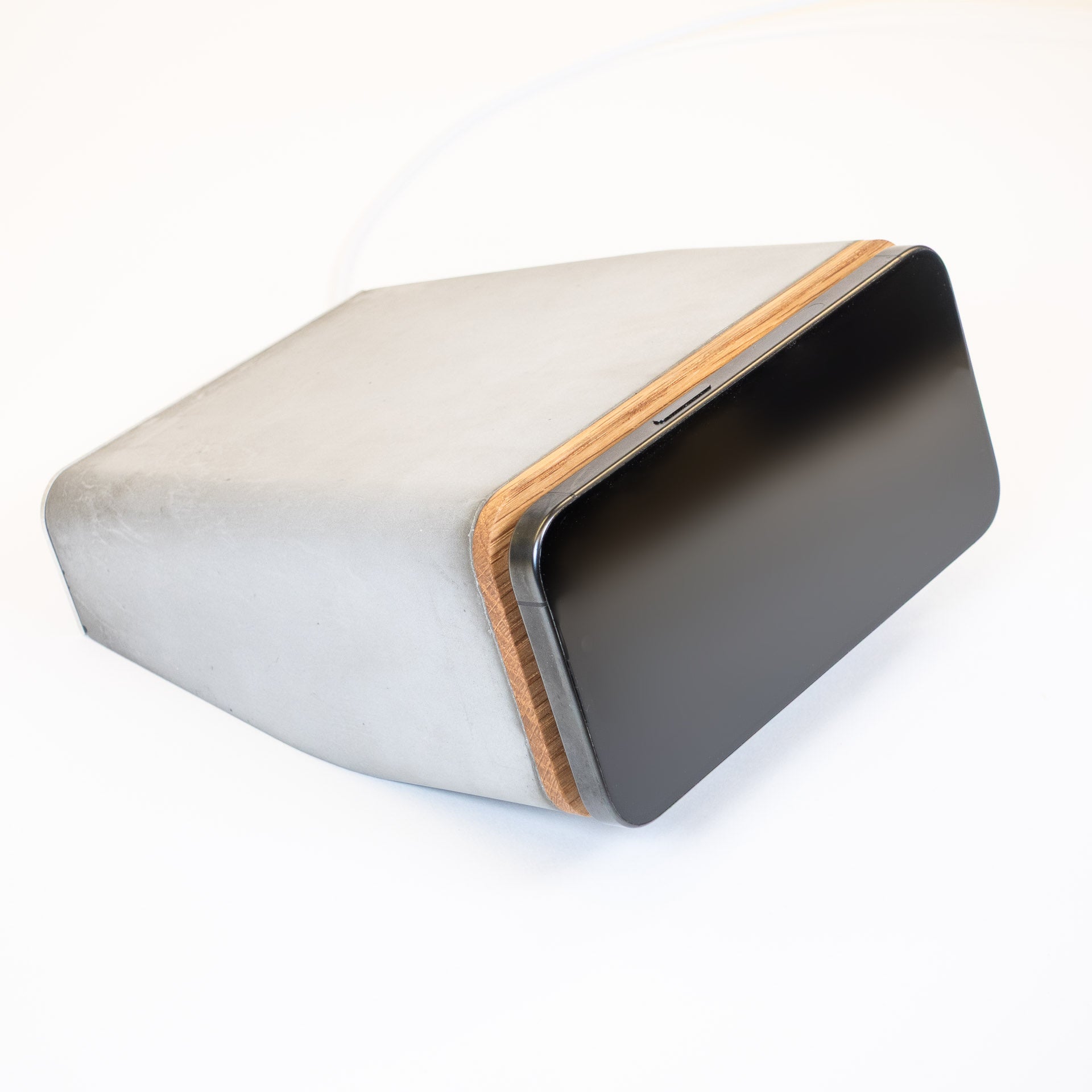 Brutalist concrete finish on modern MagSafe iPhone charging stand