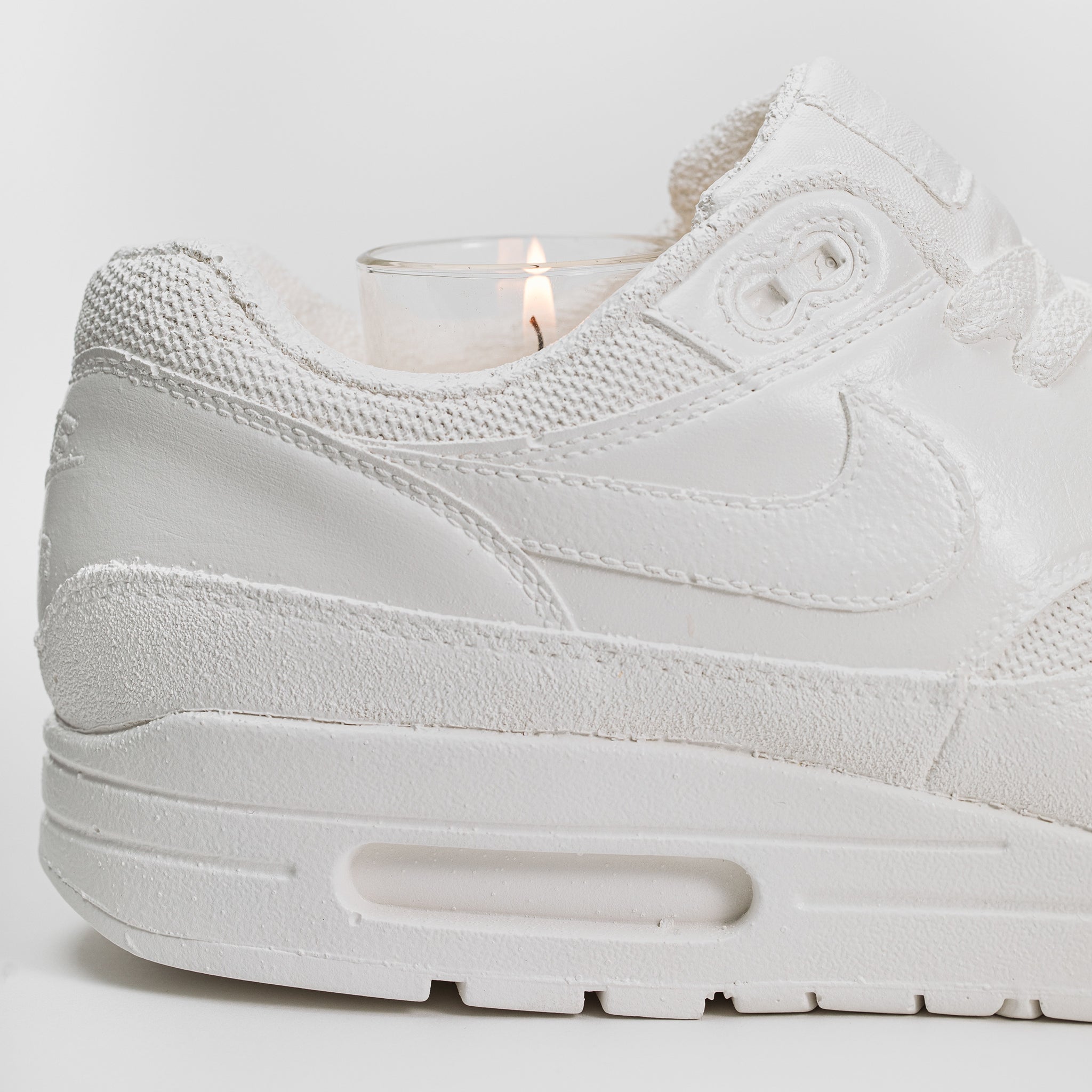 Up close die view of Nike Air Max concrete candle holder with votive candle