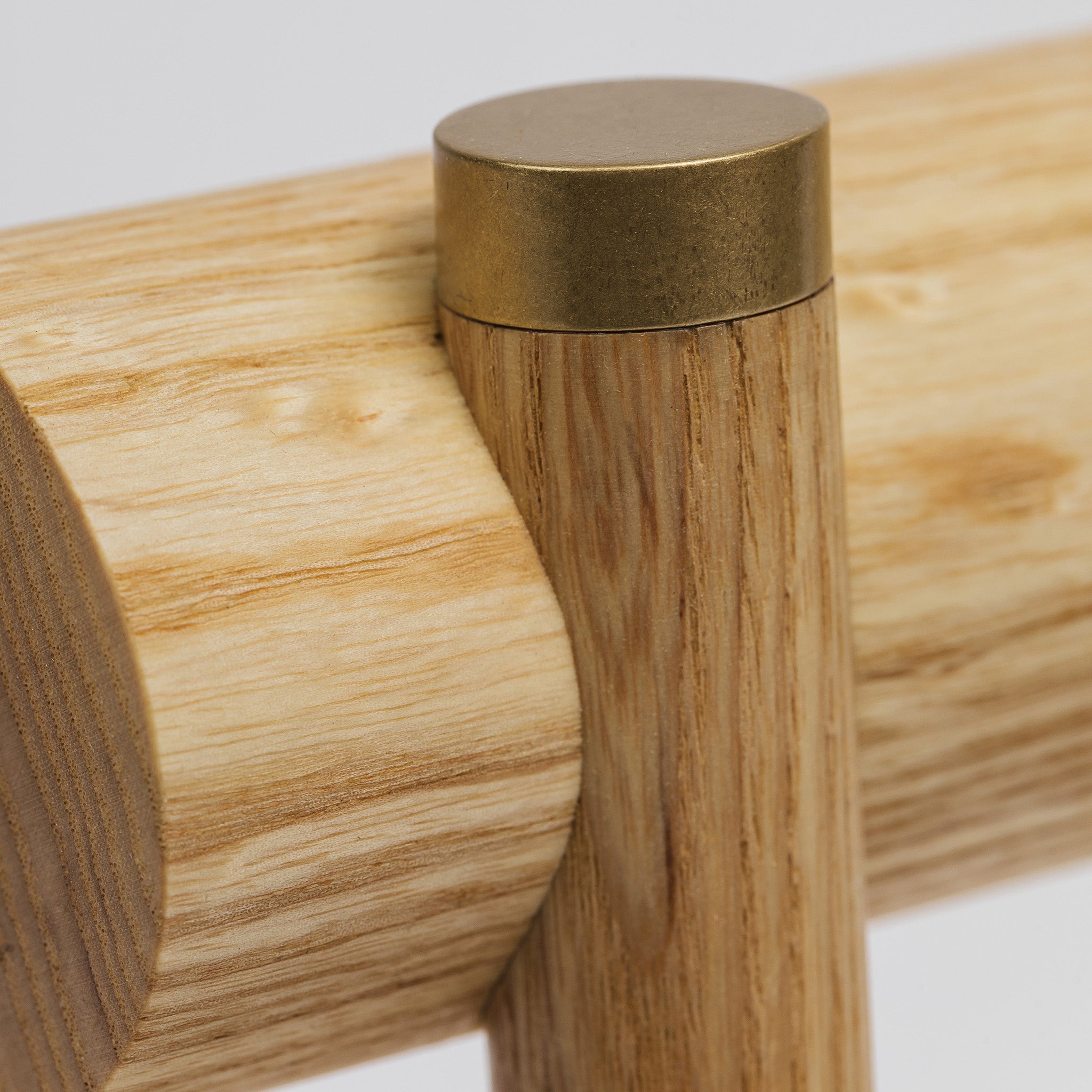 Brushed brass cap accent on table lamp post -ash