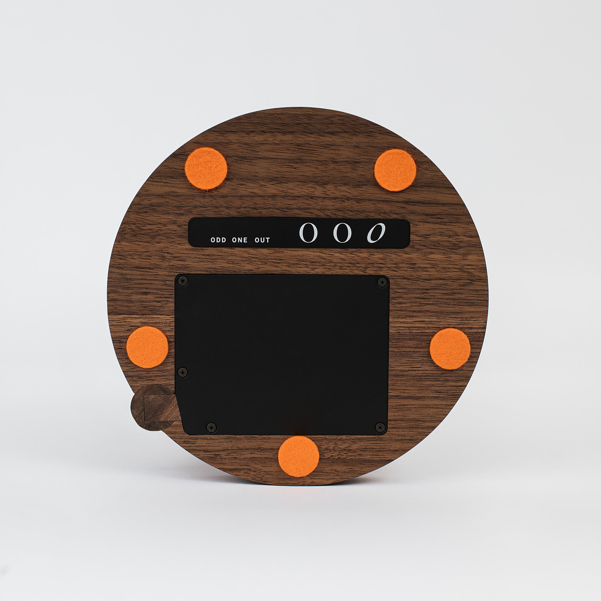 Bottom of the black ash table lamp showing the odd one out logo and orange Marino wool felts -walnut