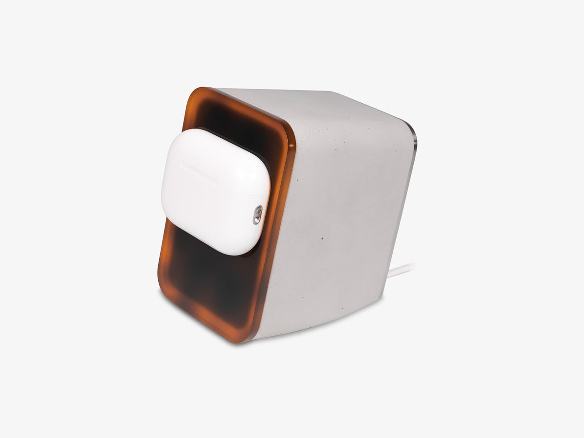 Tortoiseshell AirPod Pro Dock, in use, front-left view