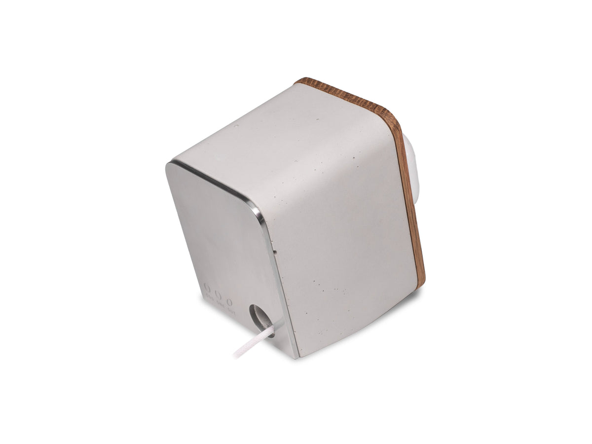White Oak AirPod Pro Dock, in use, back-right view