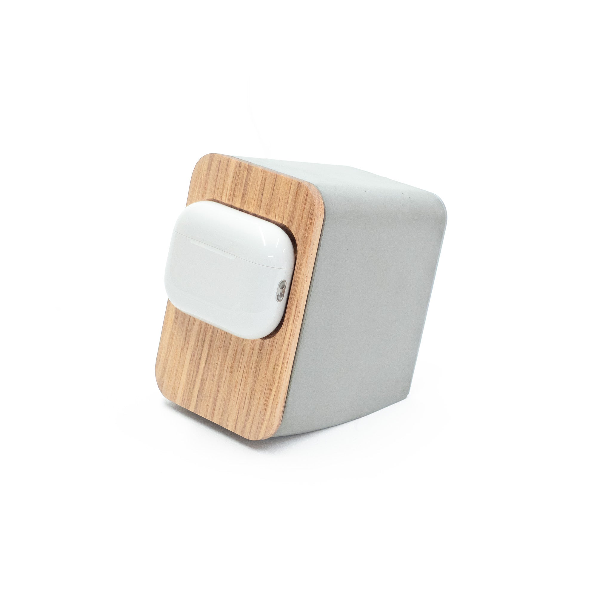 Brutalist concrete AirPods Pro MagSafe charger with white oak front panel, minimalist Japandi-inspired magnetic charging stand for modern desk setups.