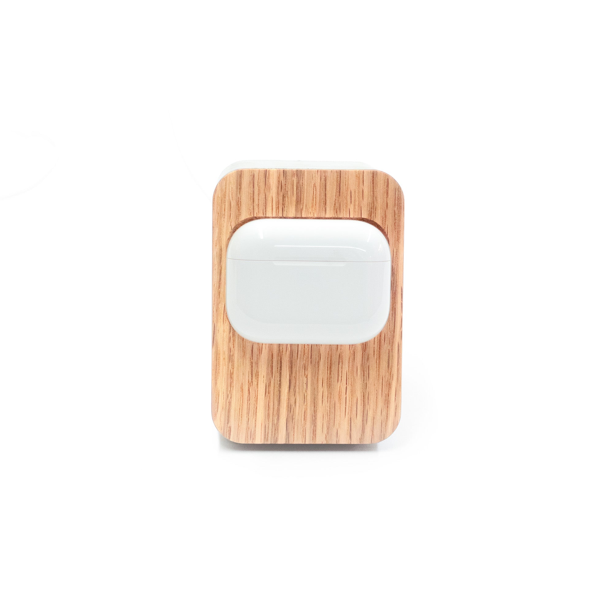 Brutalist concrete and white oak AirPods Pro MagSafe charger styled for modern minimalist workspace with Japandi influence.