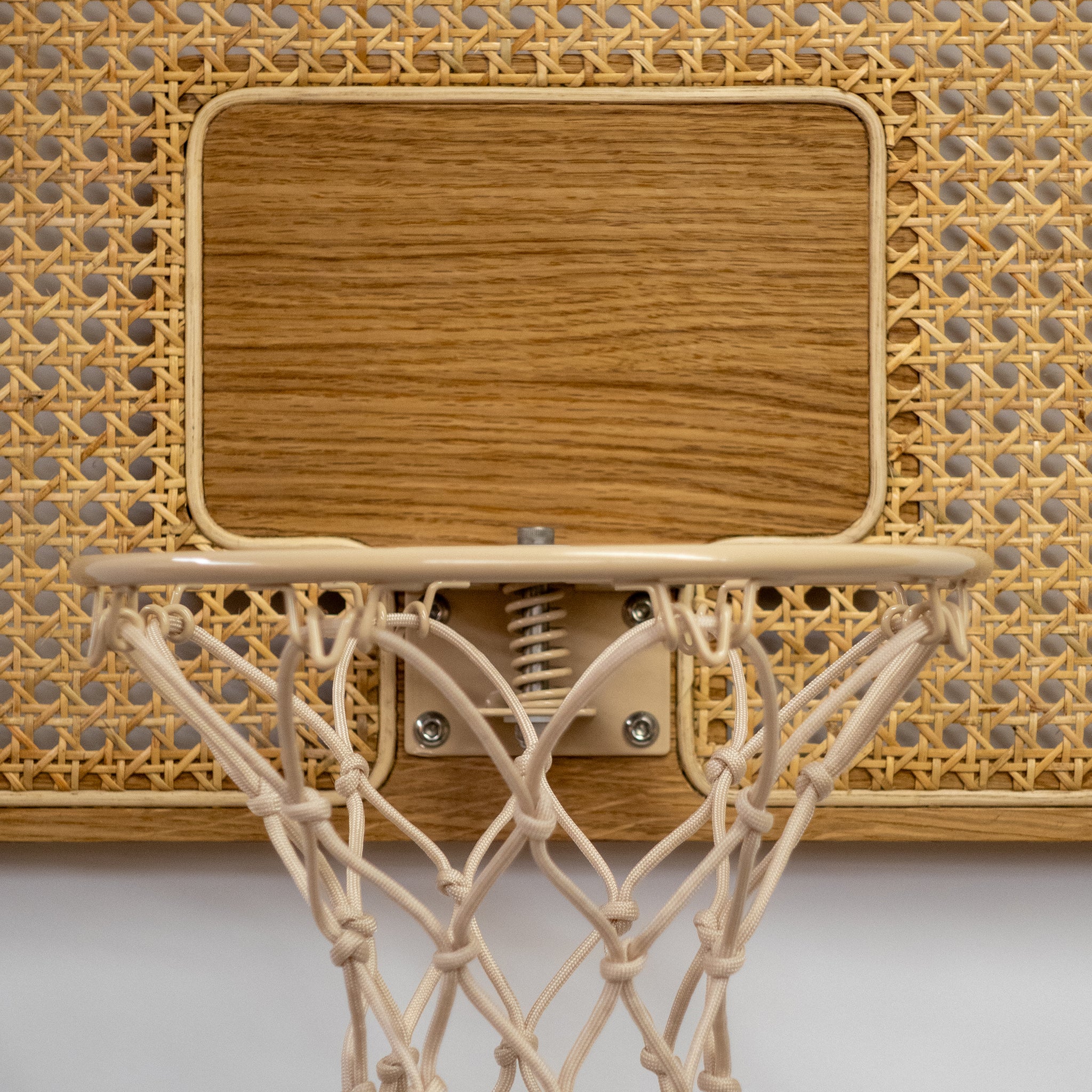 wall mounted mini basketball hoop made from rattan and white oak