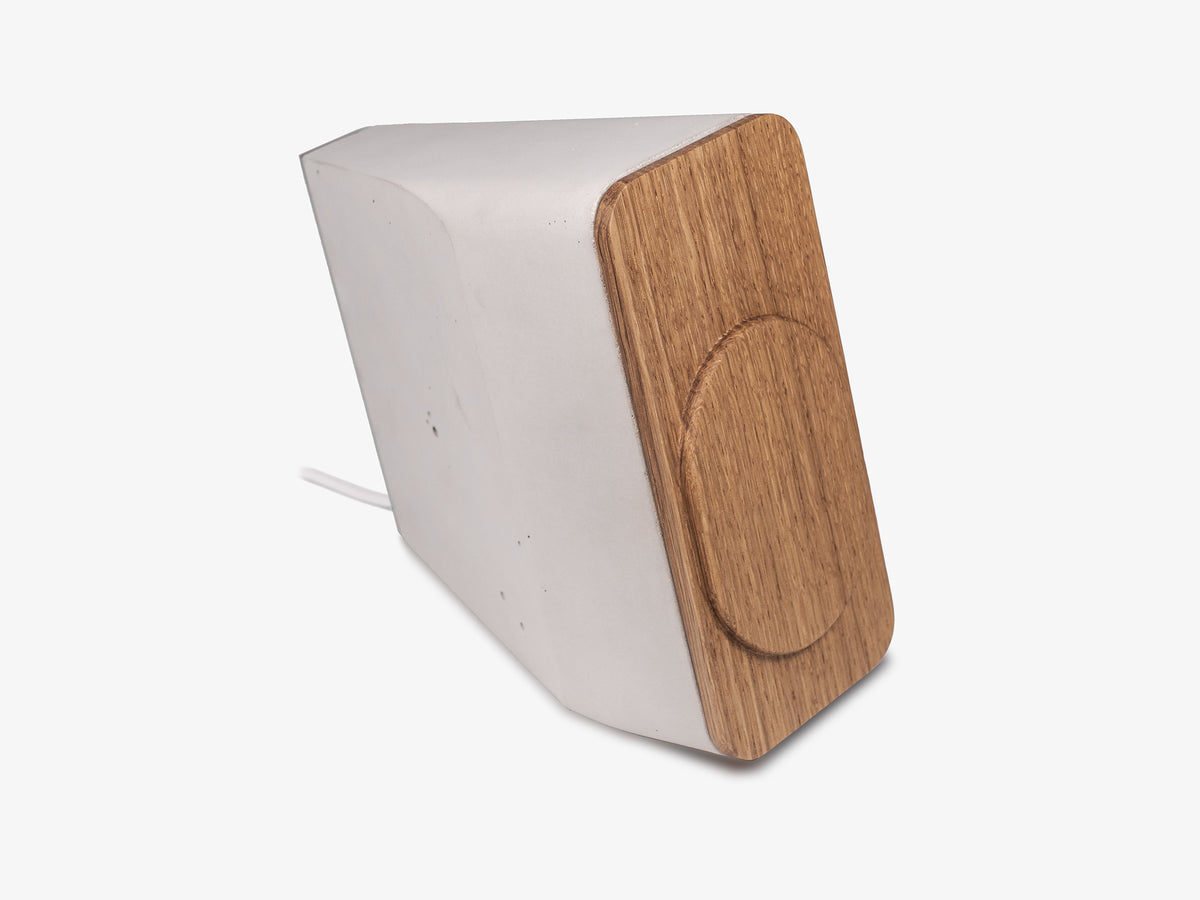 White Oak iPhone Dock, upright, charger only, front-right view