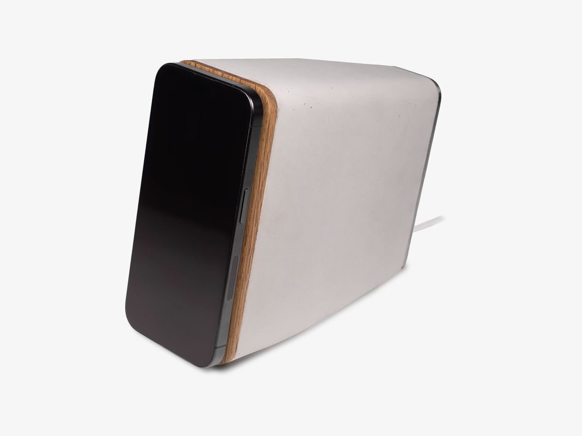 White Oak iPhone Dock, upright, with iphone, front-left view