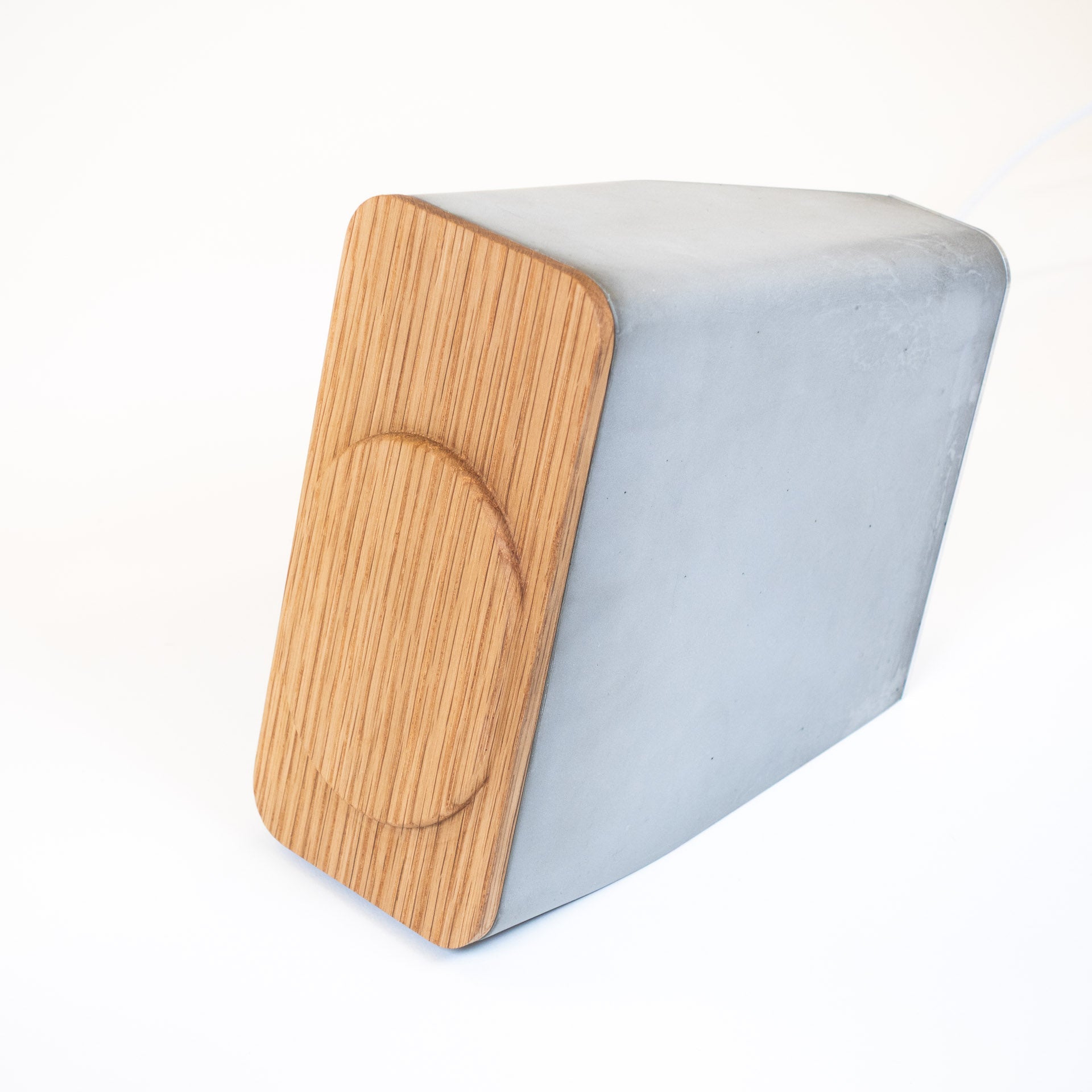 Front view of MagSafe charging stand with Brutalist concrete and white oak materials