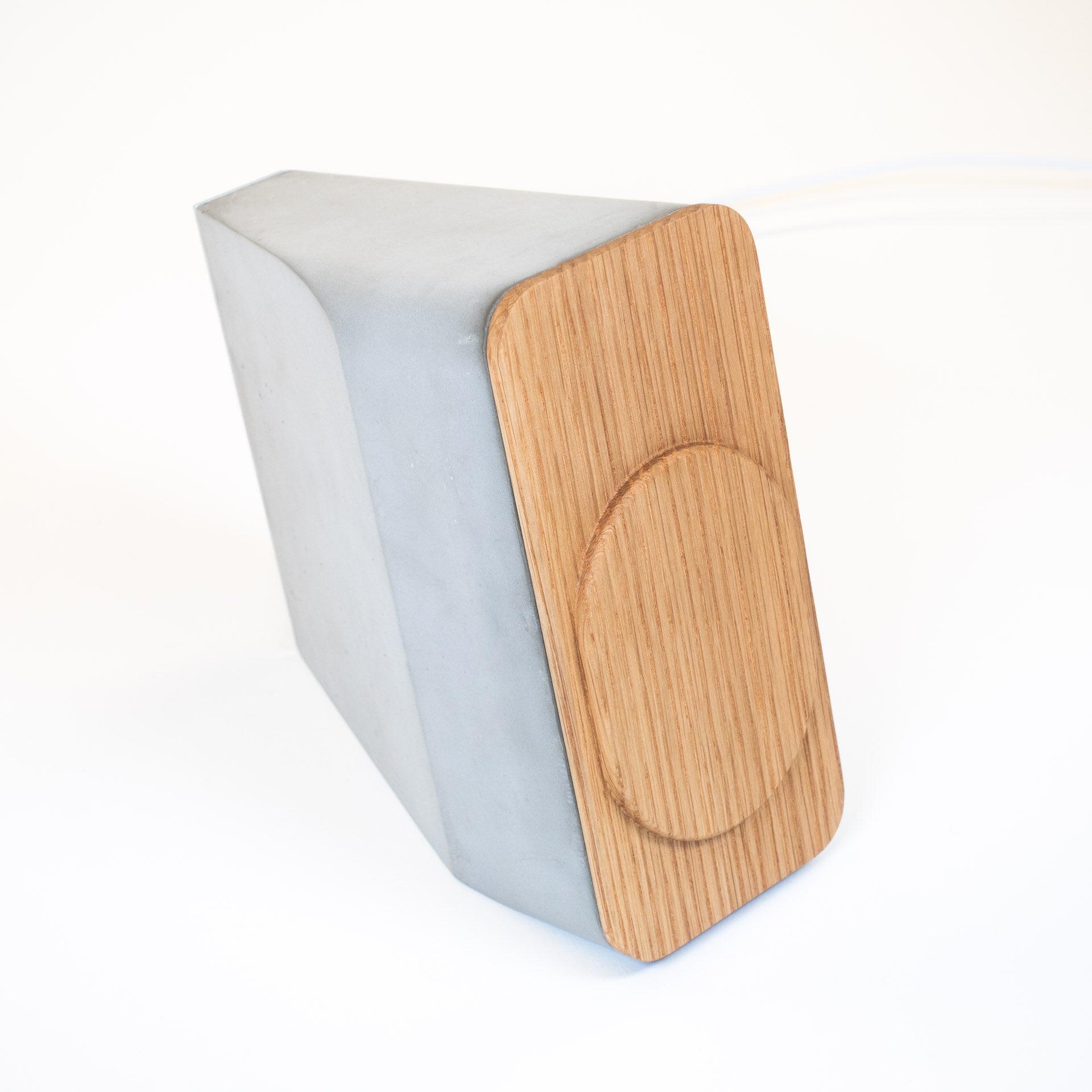 MagSafe iPhone charger made of concrete and white oak in minimalist Japandi design