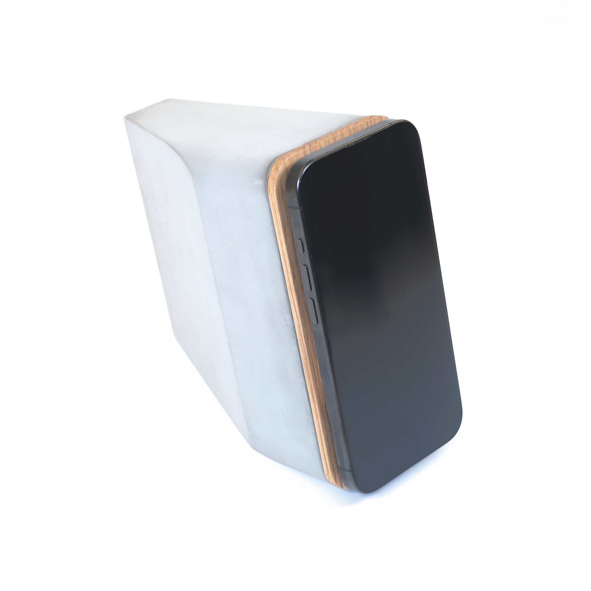 MagSafe iPhone charger with concrete base and white oak cover in minimalist design