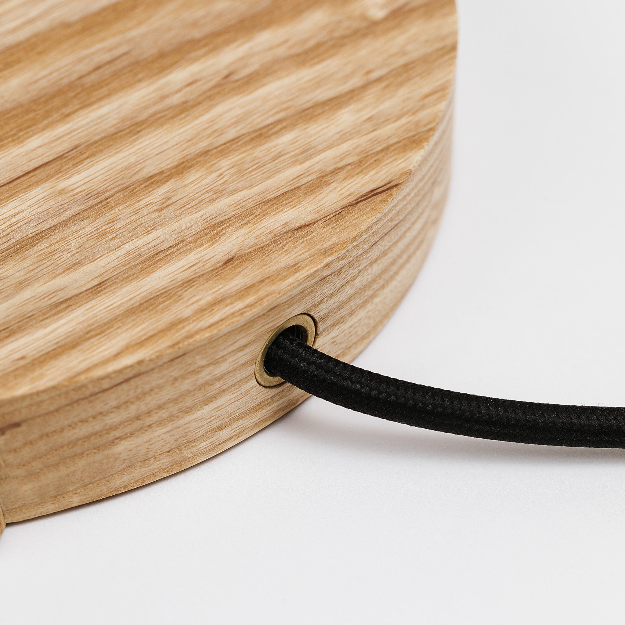 Black cloth wrapped cord at the rear of the table lamp -ash
