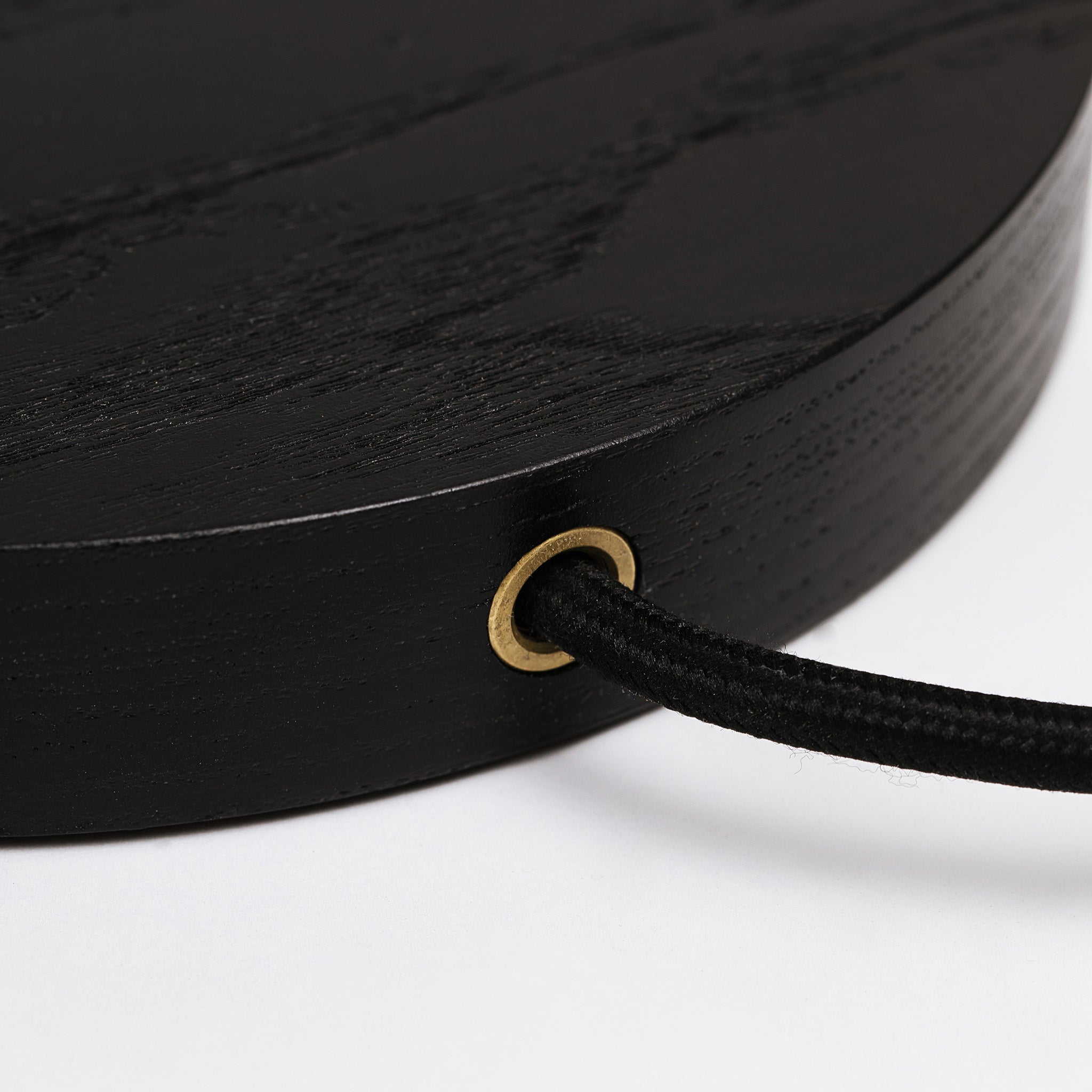Black cloth wrapped cord at the rear of the table lamp -black ash