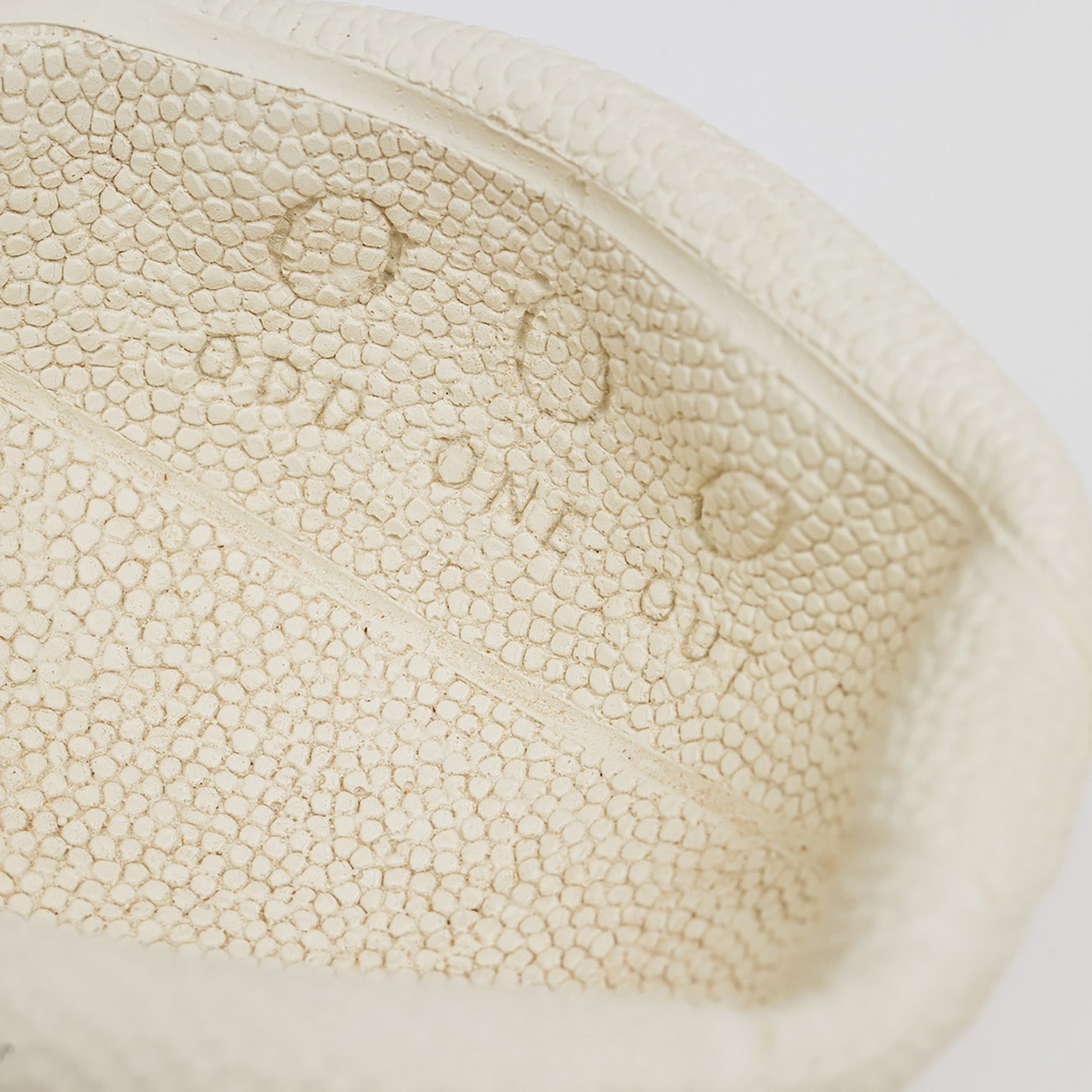 Detail shot of Odd One Out logo in the mini basketball bowl